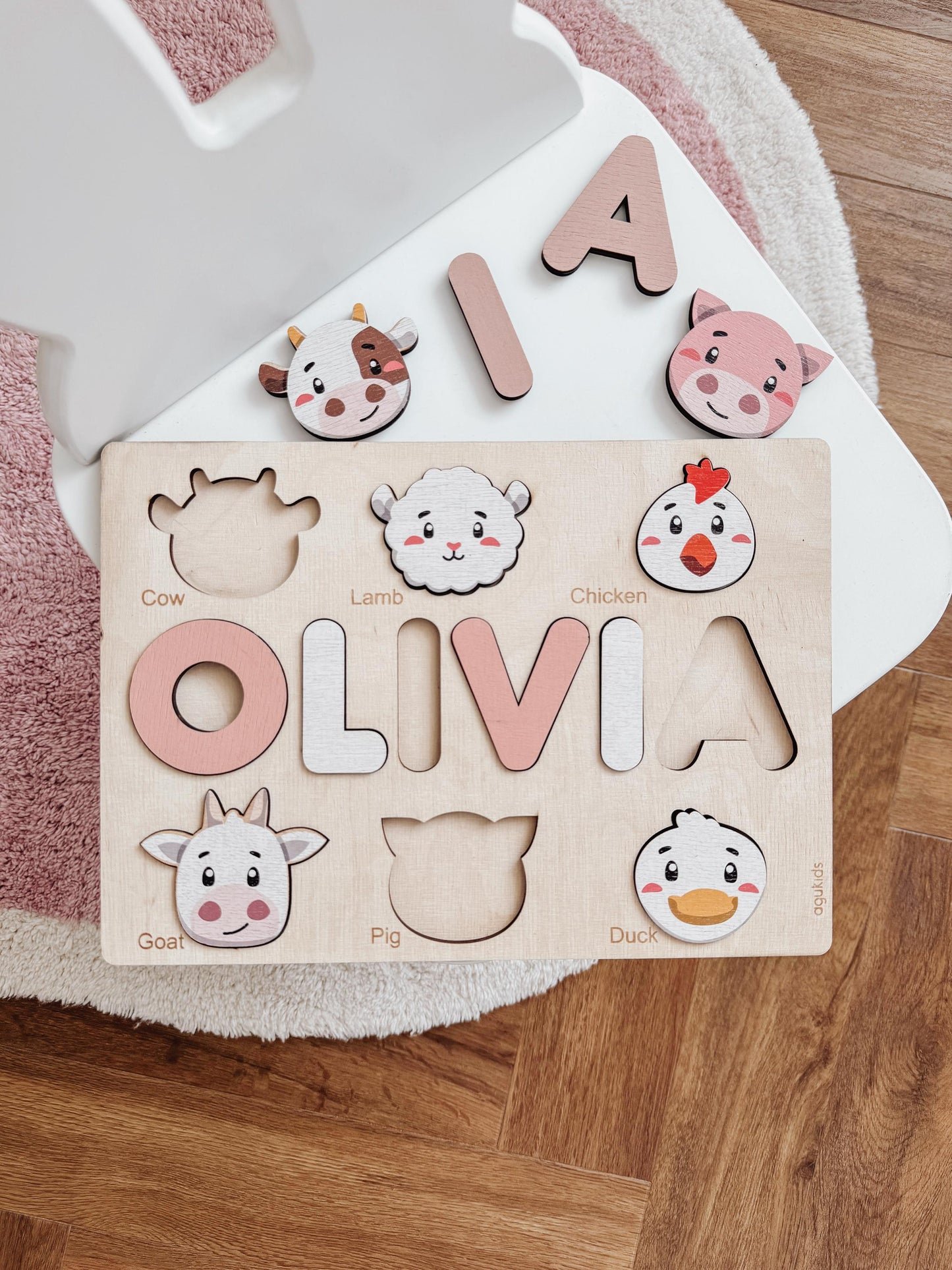 a wooden toy with animals and letters on it
