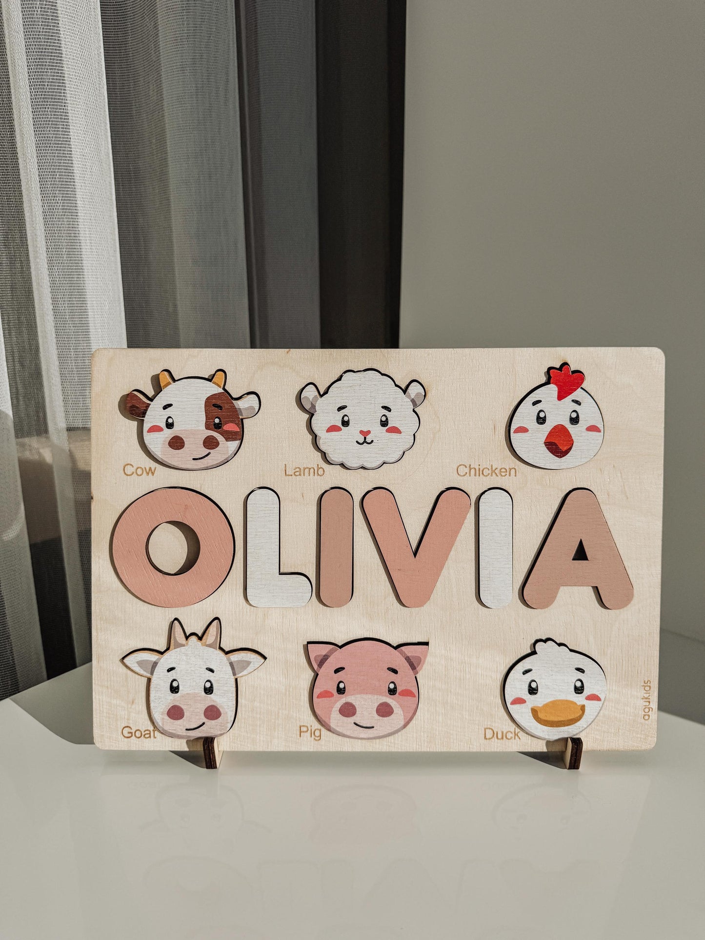 a wooden toddler puzzle with farm animals on it